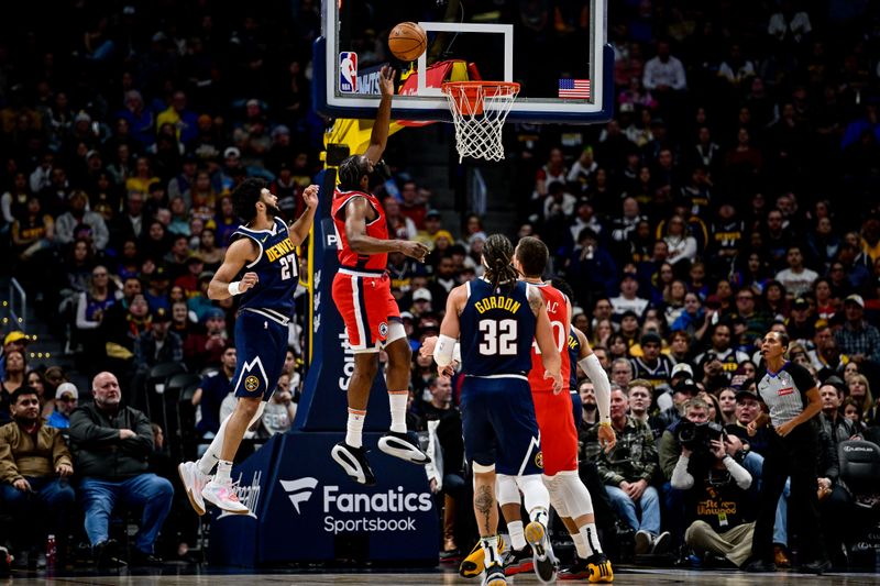 DENVER, COLORADO - DECEMBER 13: James Harden #1 of the LA Clippers scores on a layup under coverage by Jamal Murray #27 of the Denver Nuggets in the first half at Ball Arena on December 13, 2024, 2024 in Denver, Colorado. NOTE TO USER: User expressly acknowledges and agrees that, by downloading and or using this photograph, User is consenting to the terms and conditions of the Getty Images License Agreement. (Photo by Dustin Bradford/Getty Images)