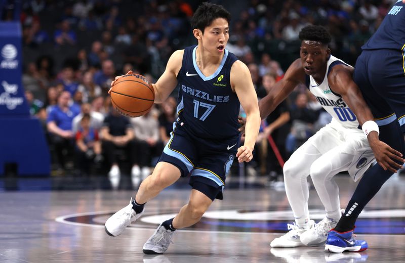 DALLAS, TX - OCTOBER 7: Yuki Kawamura #17 of the Memphis Grizzlies handles the ball against Jazian Gortman #00 of the Dallas Mavericks in the second half of a preseason game at American Airlines Center on October 7, 2024 in Dallas, Texas. NOTE TO USER: User expressly acknowledges and agrees that, by downloading and or using this photograph, User is consenting to the terms and conditions of the Getty Images License Agreement. (Photo by Ron Jenkins/Getty Images)