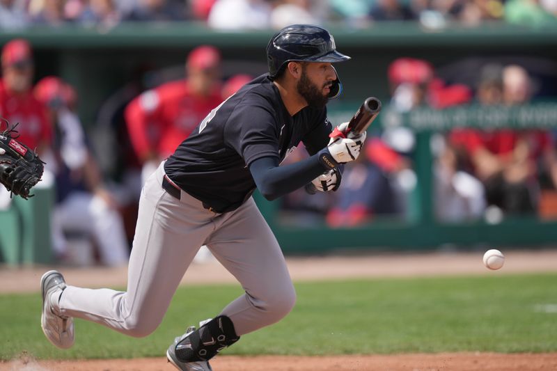 Mar 4, 2026; Fort Myers, Florida, USA;  New York Yankees shortstop Jonathan Ornelas (64) bunts in a run from third base in the fourth inning against the Boston Red Sox at JetBlue Park at Fenway South. Mandatory Credit: Jim Rassol-Imagn Images