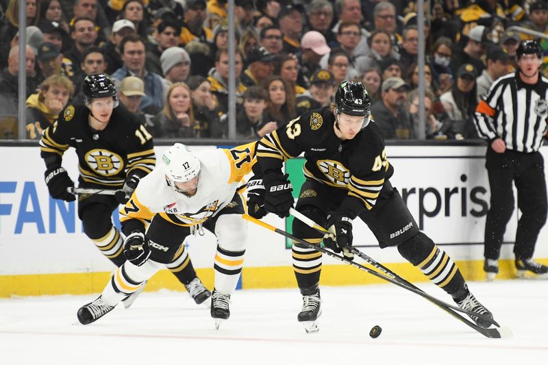 Jan 4, 2024; Boston, Massachusetts, USA;  Pittsburgh Penguins right wing Bryan Rust (17) and Boston Bruins left wing Danton Heinen (43) battle for the puck during the second period at TD Garden. Mandatory Credit: Bob DeChiara-USA TODAY Sports