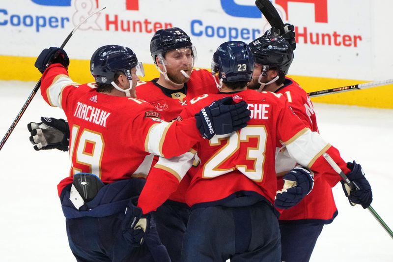 Dec 30, 2023; Sunrise, Florida, USA;  Florida Panthers center Sam Bennett (9) celebrates a goal with teammates against the Montreal Canadiens during the third period at Amerant Bank Arena. Mandatory Credit: Jim Rassol-USA TODAY Sports