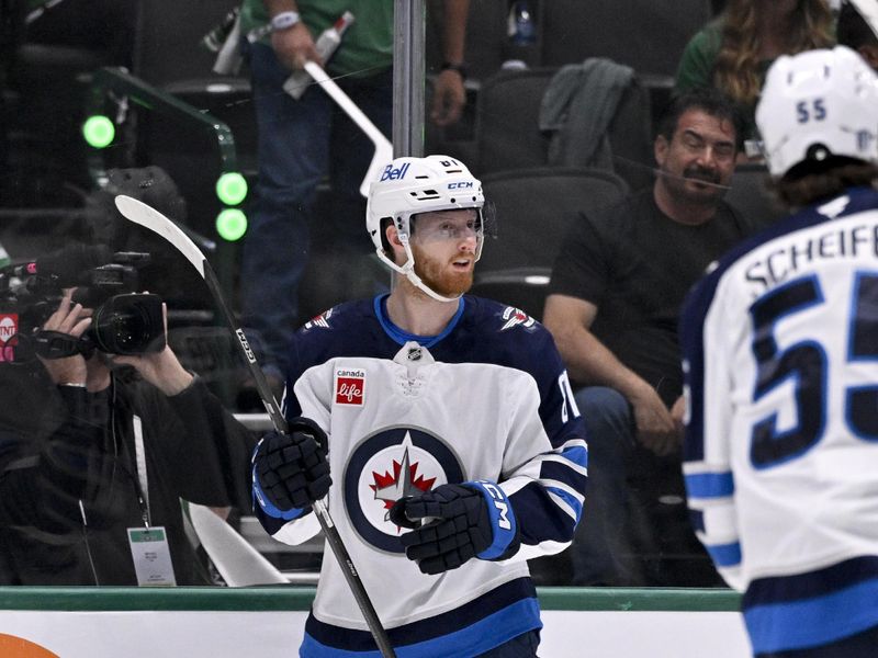 May 11, 2025; Dallas, Texas, USA; Winnipeg Jets left wing Kyle Connor (81) celebrates scoring a goal against the Dallas Stars during the first period in game three of the second round of the 2025 Stanley Cup Playoffs at American Airlines Center. Mandatory Credit: Jerome Miron-Imagn Images