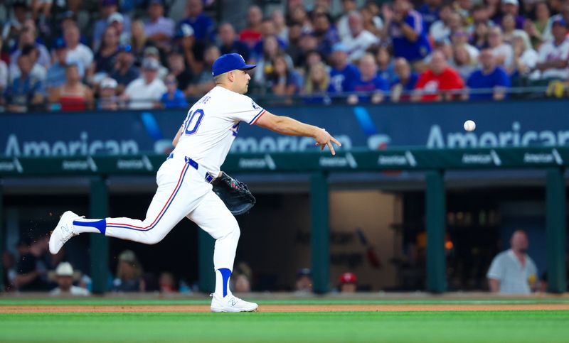 Jul 24, 2024; Arlington, Texas, USA; Texas Rangers first baseman Nathaniel Lowe (30) throws to first base for an out during the first inning against the Chicago White Sox at Globe Life Field. Mandatory Credit: Kevin Jairaj-USA TODAY Sports