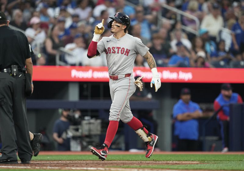 Jun 19, 2024; Toronto, Ontario, CAN; Boston Red Sox right fielder Jarren Duran (16) celebrates after hitting a home run against the Toronto Blue Jays during fifth inning at Rogers Centre. Mandatory Credit: Nick Turchiaro-USA TODAY Sports