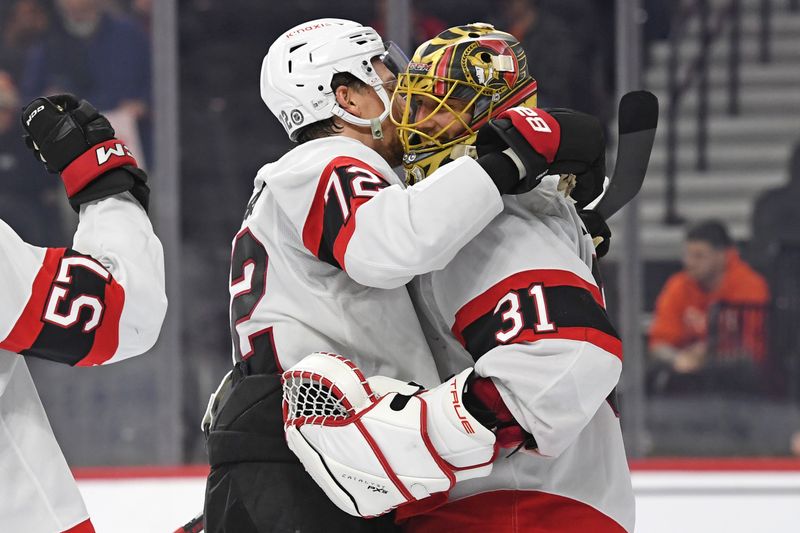 Mar 11, 2025; Philadelphia, Pennsylvania, USA; Ottawa Senators center Shane Pinto (12) and goaltender Anton Forsberg (31) celebrate win against the Philadelphia Flyers at Wells Fargo Center. Mandatory Credit: Eric Hartline-Imagn Images