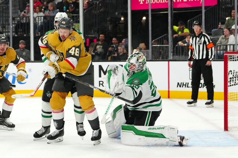 Dec 6, 2024; Las Vegas, Nevada, USA; Vegas Golden Knights center Tomas Hertl (48) looks to deflect an incoming shot in front of Dallas Stars goaltender Jake Oettinger (29) during the second period at T-Mobile Arena. Mandatory Credit: Stephen R. Sylvanie-Imagn Images