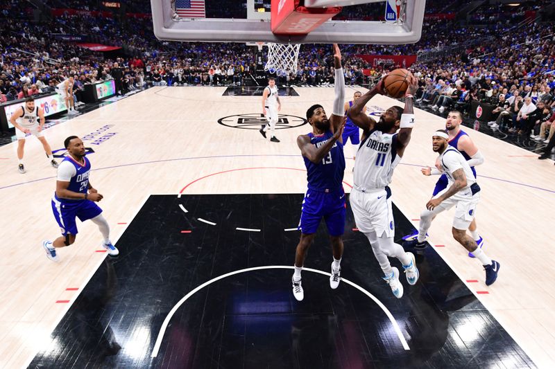 LOS ANGELES, CA - APRIL 21:  Kyrie Irving #11 of the Dallas Mavericks drives to the basket during the game against the LA Clippers during Round 1 Game 1 of the 2024 NBA Playoffs on April 21, 2024 at Crypto.Com Arena in Los Angeles, California. NOTE TO USER: User expressly acknowledges and agrees that, by downloading and/or using this Photograph, user is consenting to the terms and conditions of the Getty Images License Agreement. Mandatory Copyright Notice: Copyright 2024 NBAE (Photo by Adam Pantozzi/NBAE via Getty Images)