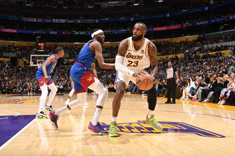 LOS ANGELES, CA - MARCH 2: LeBron James #23 of the Los Angeles Lakers shoots the ball during the game against the Denver Nuggets on March 2, 2024 at Crypto.Com Arena in Los Angeles, California. NOTE TO USER: User expressly acknowledges and agrees that, by downloading and/or using this Photograph, user is consenting to the terms and conditions of the Getty Images License Agreement. Mandatory Copyright Notice: Copyright 2024 NBAE (Photo by Andrew D. Bernstein/NBAE via Getty Images)