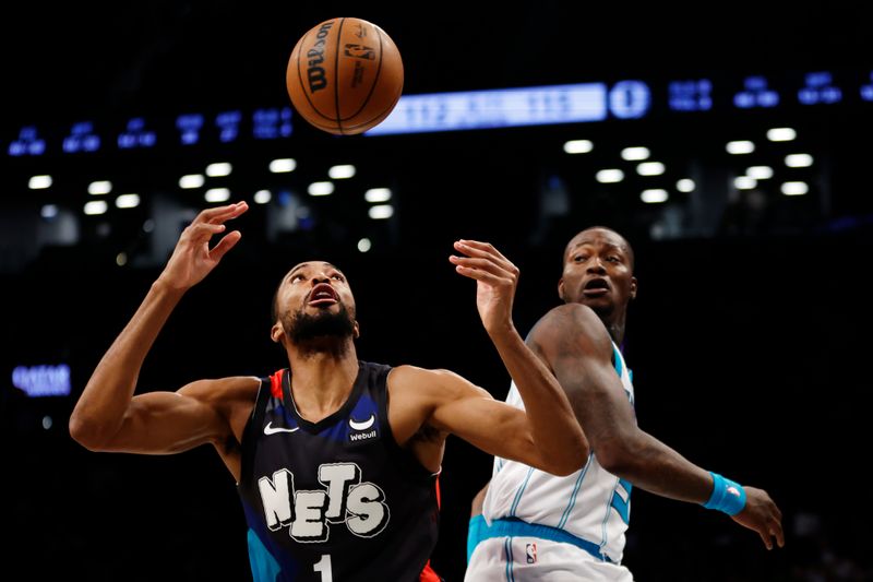 NEW YORK, NEW YORK - NOVEMBER 30: Mikal Bridges #1 of the Brooklyn Nets loses control of the ball as Terry Rozier #3 of the Charlotte Hornets defends during the second half at Barclays Center on November 30, 2023 in the Brooklyn borough of New York City. The Hornets won 129-128. NOTE TO USER: User expressly acknowledges and agrees that, by downloading and/or using this Photograph, user is consenting to the terms and conditions of the Getty Images License Agreement. (Photo by Sarah Stier/Getty Images)