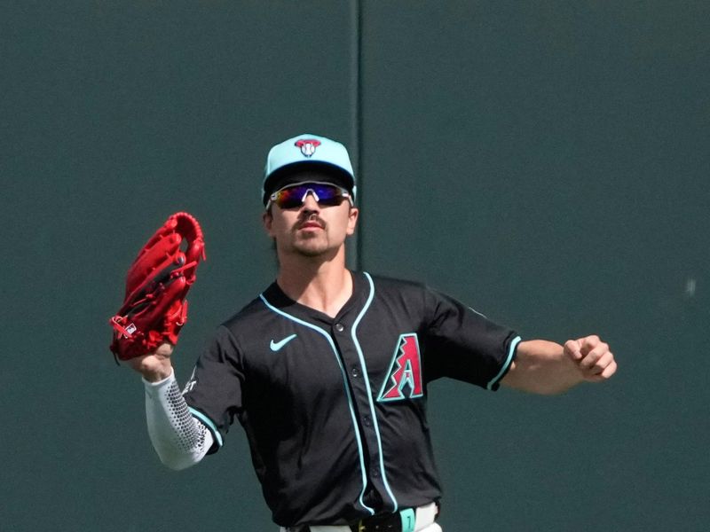 Mar 8, 2024; Salt River Pima-Maricopa, Arizona, USA; Arizona Diamondbacks left fielder Corbin Carroll (7) makes the running catch for an out against the Chicago Cubs in the first inning at Salt River Fields at Talking Stick. Mandatory Credit: Rick Scuteri-USA TODAY Sports