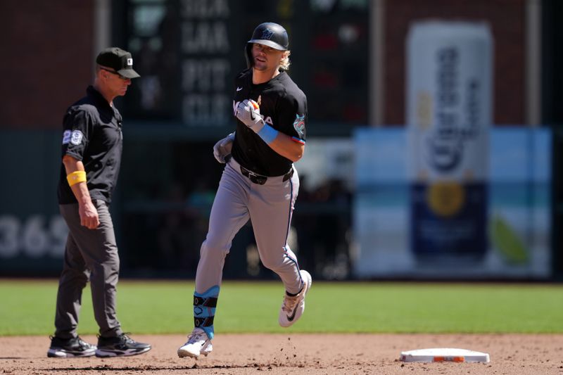 Sep 1, 2024; San Francisco, California, USA; Miami Marlins left fielder Kyle Stowers (28) rounds the bases after hitting a home run against the San Francisco Giants during the fifth inning at Oracle Park. Mandatory Credit: Darren Yamashita-USA TODAY Sports