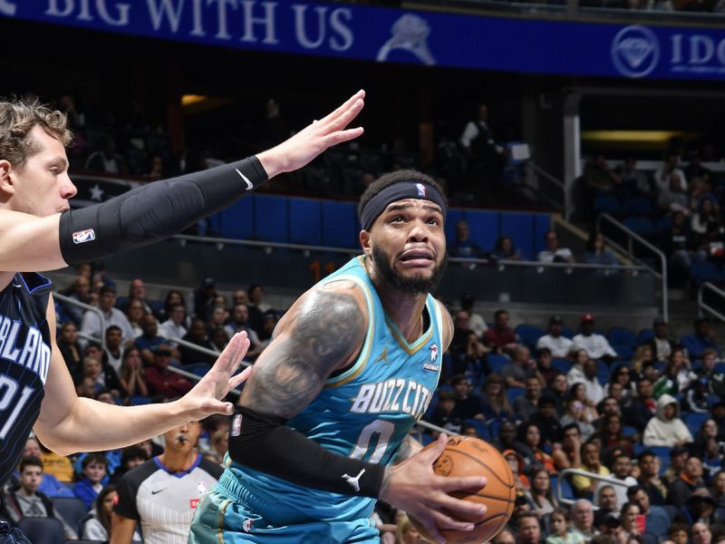 ORLANDO, FL - MARCH 19: Miles Bridges #0 of the Charlotte Hornets drives to the basket during the game against the Orlando Magic on March 19, 2024 at the Kia Center in Orlando, Florida. NOTE TO USER: User expressly acknowledges and agrees that, by downloading and or using this photograph, User is consenting to the terms and conditions of the Getty Images License Agreement. Mandatory Copyright Notice: Copyright 2024 NBAE (Photo by Fernando Medina/NBAE via Getty Images)