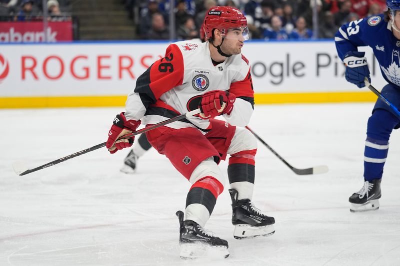 Nov 9, 2025; Toronto, Ontario, CAN; Carolina Hurricanes defenseman Sean Walker (26) skates against the Toronto Maple Leafs during the third period at Scotiabank Arena. Mandatory Credit: John E. Sokolowski-Imagn Images
