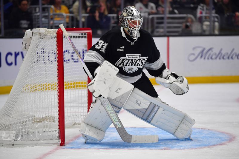 Jan 20, 2026; Los Angeles, California, USA; Los Angeles Kings goaltender Anton Forsberg (31) defends the goal against the New York Rangers during the third period at Crypto.com Arena. Mandatory Credit: Gary A. Vasquez-Imagn Images