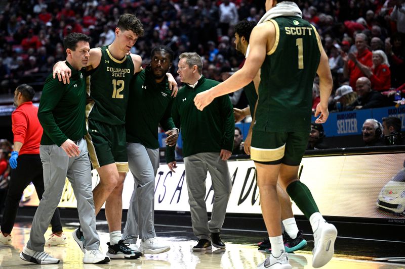 Feb 13, 2024; San Diego, California, USA; Colorado State Rams forward Patrick Cartier (12) is helped off the court after suffering an injury during the second half against the San Diego State Aztecs at Viejas Arena. Mandatory Credit: Orlando Ramirez-USA TODAY Sports