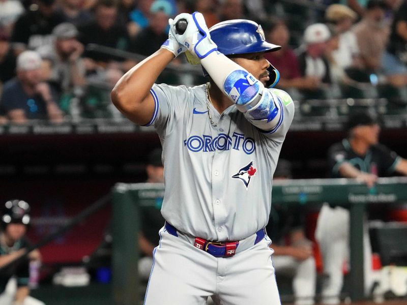 Jul 12, 2024; Phoenix, Arizona, USA; Toronto Blue Jays first base Vladimir Guerrero Jr. (27) bats against the Arizona Diamondbacks during the first inning at Chase Field. Mandatory Credit: Joe Camporeale-USA TODAY Sports