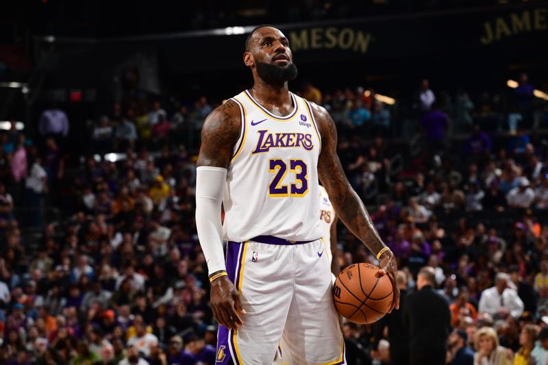 PHOENIX, AZ - FEBRUARY 25: LeBron James #23 of the Los Angeles Lakers shoots a free throw during the game against the Phoenix Suns on February 25, 2024 at Footprint Center in Phoenix, Arizona. NOTE TO USER: User expressly acknowledges and agrees that, by downloading and or using this photograph, user is consenting to the terms and conditions of the Getty Images License Agreement. Mandatory Copyright Notice: Copyright 2024 NBAE (Photo by Kate Frese/NBAE via Getty Images)