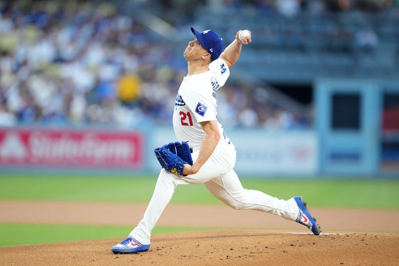 Aug 20, 2024; Los Angeles, California, USA; Los Angeles Dodgers starting pitcher Walker Buehler (21) throws in the first inning against the Seattle Mariners at Dodger Stadium. Mandatory Credit: Kirby Lee-USA TODAY Sports