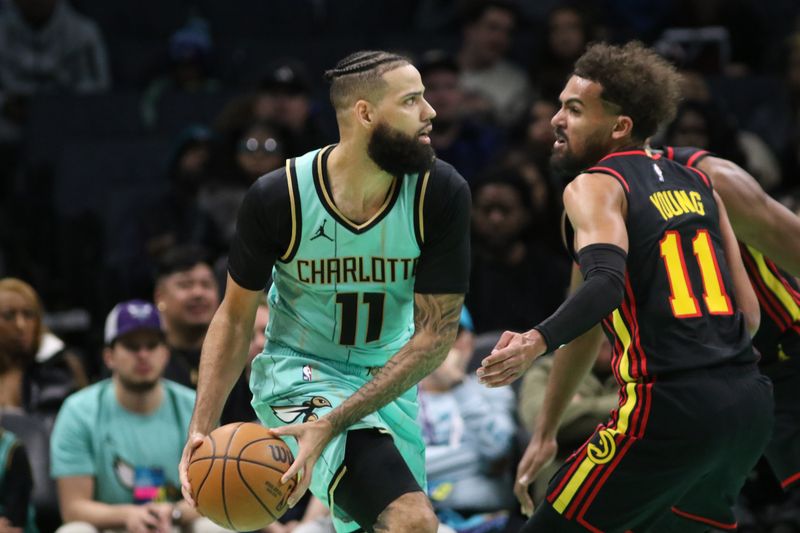 CHARLOTTE, NC - NOVEMBER 30: Cody Martin #11 of the Charlotte Hornets handles the ball during the game against the Atlanta Hawks on November 30, 2024 at Spectrum Center in Charlotte, North Carolina. NOTE TO USER: User expressly acknowledges and agrees that, by downloading and or using this photograph, User is consenting to the terms and conditions of the Getty Images License Agreement. Mandatory Copyright Notice: Copyright 2024 NBAE (Photo by Brock Williams-Smith/NBAE via Getty Images)