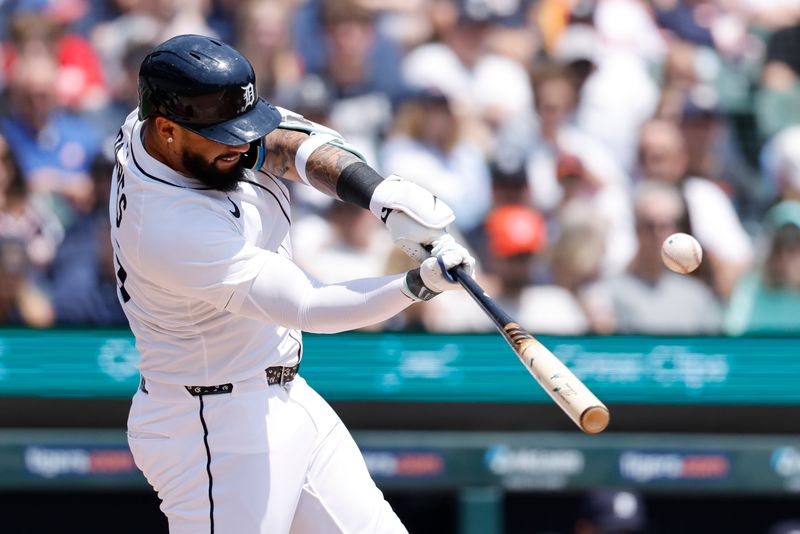 Jun 7, 2025; Detroit, Michigan, USA;  Detroit Tigers second baseman Gleyber Torres (25) hits a single in the first inning against the Chicago Cubs at Comerica Park. Mandatory Credit: Rick Osentoski-Imagn Images