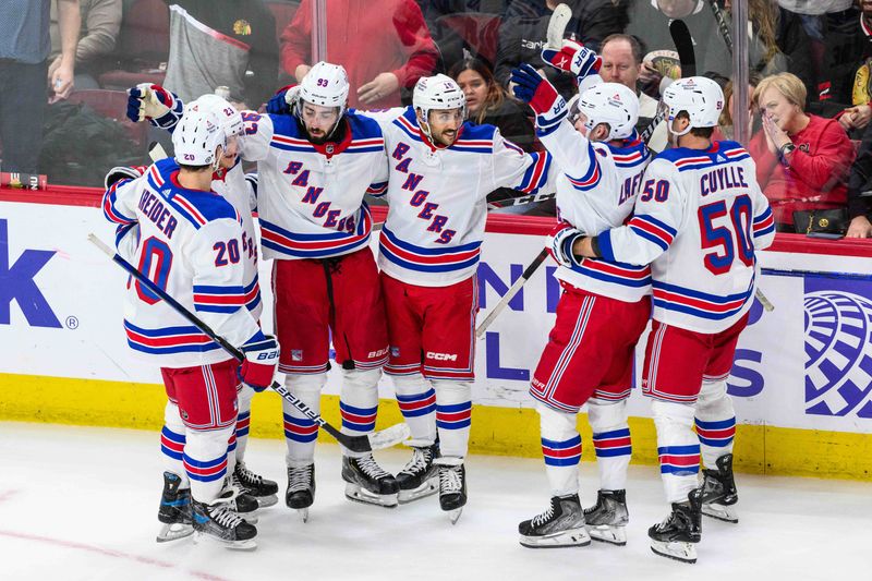 Feb 9, 2024; Chicago, Illinois, USA; New York Rangers center Mika Zibanejad (93) celebrates his goal with teammates against the Chicago Blackhawks during overtime at the United Center. Mandatory Credit: Daniel Bartel-USA TODAY Sports