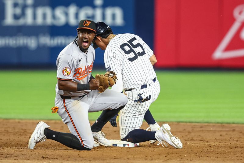 Jun 19, 2024; Bronx, New York, USA;  Baltimore Orioles second baseman Jorge Mateo (3) reacts after tagging out New York Yankees pinch runner Oswaldo Cabrera (95) attempting to steal to second base in the tenth inning at Yankee Stadium. Mandatory Credit: Wendell Cruz-USA TODAY Sports