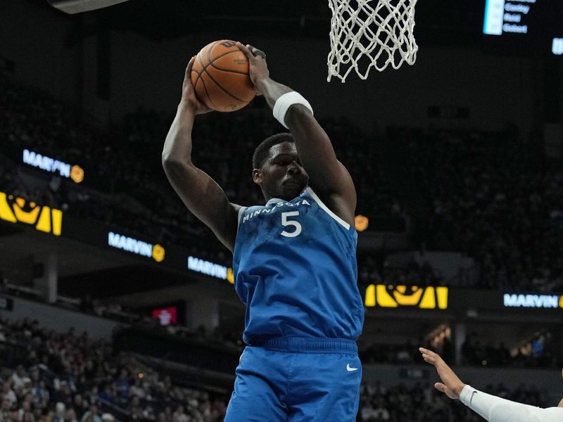 MINNEAPOLIS, MN -  MARCH 22: Anthony Edwards #5 of the Minnesota Timberwolves rebounds the ball during the game against the Cleveland Cavaliers on March 22, 2024 at Target Center in Minneapolis, Minnesota. NOTE TO USER: User expressly acknowledges and agrees that, by downloading and or using this Photograph, user is consenting to the terms and conditions of the Getty Images License Agreement. Mandatory Copyright Notice: Copyright 2024 NBAE (Photo by Jordan Johnson/NBAE via Getty Images)