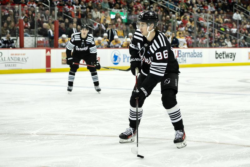 Apr 7, 2024; Newark, New Jersey, USA; New Jersey Devils center Jack Hughes (86) skates with the puck during the second period against the Nashville Predators at Prudential Center. Mandatory Credit: John Jones-USA TODAY Sports