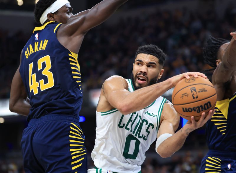 INDIANAPOLIS, INDIANA - OCTOBER 30: Jayson Tatum #0 of the Boston Celtics passes the ball around Pascal Siakam #43 of the Indiana Pacers during the first half at Gainbridge Fieldhouse on October 30, 2024 in Indianapolis, Indiana. NOTE TO USER: User expressly acknowledges and agrees that, by downloading and or using this photograph, User is consenting to the terms and conditions of the Getty Images License Agreement. (Photo by Justin Casterline/Getty Images)