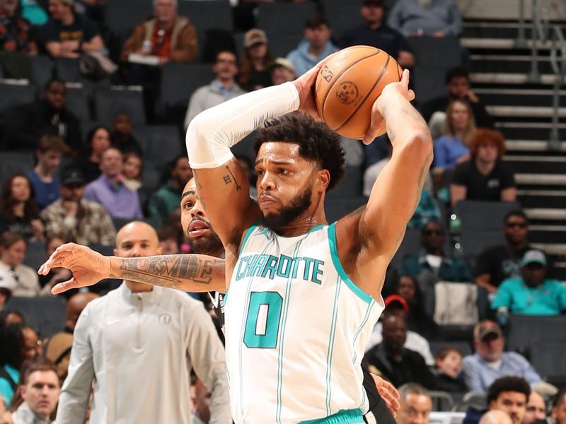 CHARLOTTE, NC - JANUARY 29:  Miles Bridges #0 of the Charlotte Hornets handles the ball during the game against the Brooklyn Nets on January 29, 2025 at Spectrum Center in Charlotte, North Carolina. NOTE TO USER: User expressly acknowledges and agrees that, by downloading and or using this photograph, User is consenting to the terms and conditions of the Getty Images License Agreement. Mandatory Copyright Notice: Copyright 2025 NBAE (Photo by Kent Smith/NBAE via Getty Images)