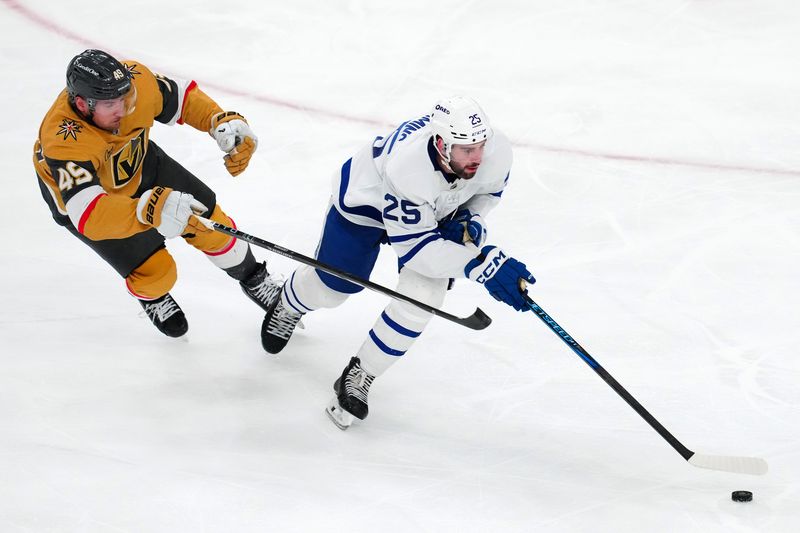 Mar 5, 2025; Las Vegas, Nevada, USA; Toronto Maple Leafs defenseman Conor Timmins (25) skates ahead of Vegas Golden Knights center Ivan Barbashev (49) during the third period at T-Mobile Arena. Mandatory Credit: Stephen R. Sylvanie-Imagn Images