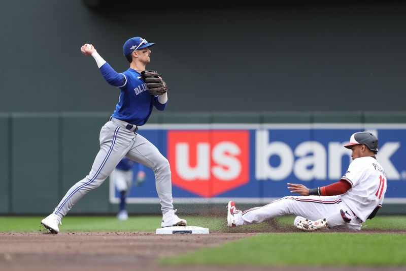 Oct 4, 2023; Minneapolis, Minnesota, USA; Toronto Blue Jays second baseman Cavan Biggio (8) forces out Minnesota Twins second baseman Jorge Polanco (11) in the first inning during game two of the Wildcard series for the 2023 MLB playoffs at Target Field. Mandatory Credit: Jesse Johnson-USA TODAY Sports