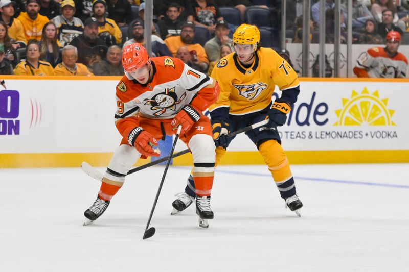 Oct 21, 2025; Nashville, Tennessee, USA;  Anaheim Ducks right wing Troy Terry (19) skates with the puck against the Nashville Predators during the second period at Bridgestone Arena. Mandatory Credit: Steve Roberts-Imagn Images