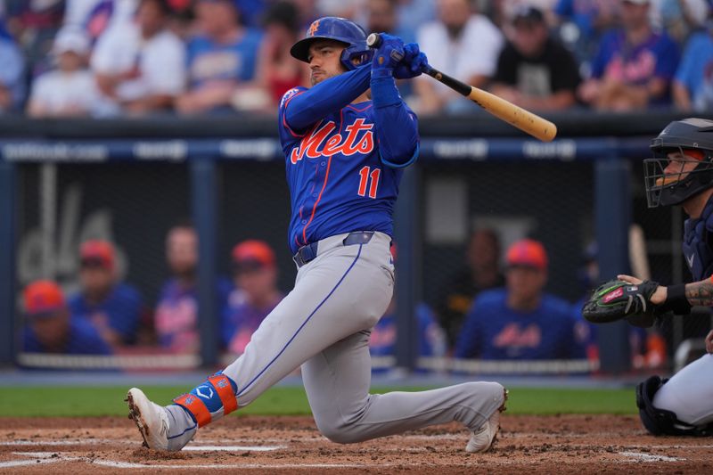 Mar 16, 2024; West Palm Beach, Florida, USA;  New York Mets third baseman Jose Iglesias (11) hits a single in the second inning against the Houston Astros at CACTI Park of the Palm Beaches. Mandatory Credit: Jim Rassol-USA TODAY Sports
