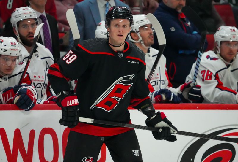 Apr 5, 2024; Raleigh, North Carolina, USA; Carolina Hurricanes center Jake Guentzel (59) watches the play against the Washington Capitals during the second period at PNC Arena. Mandatory Credit: James Guillory-USA TODAY Sports