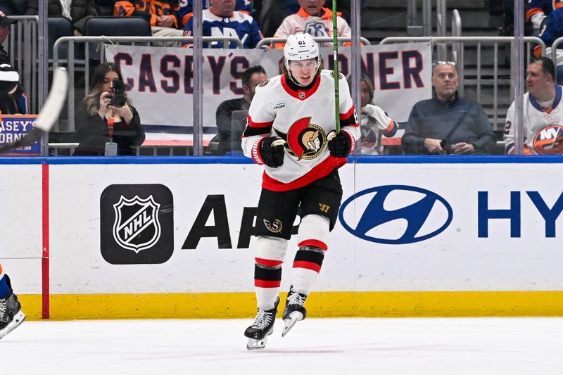 Jan 14, 2025; Elmont, New York, USA;  Ottawa Senators right wing Adam Gaudette (81) celebrates his goal against the New York Islanders during the second period at UBS Arena. Mandatory Credit: Dennis Schneidler-Imagn Images