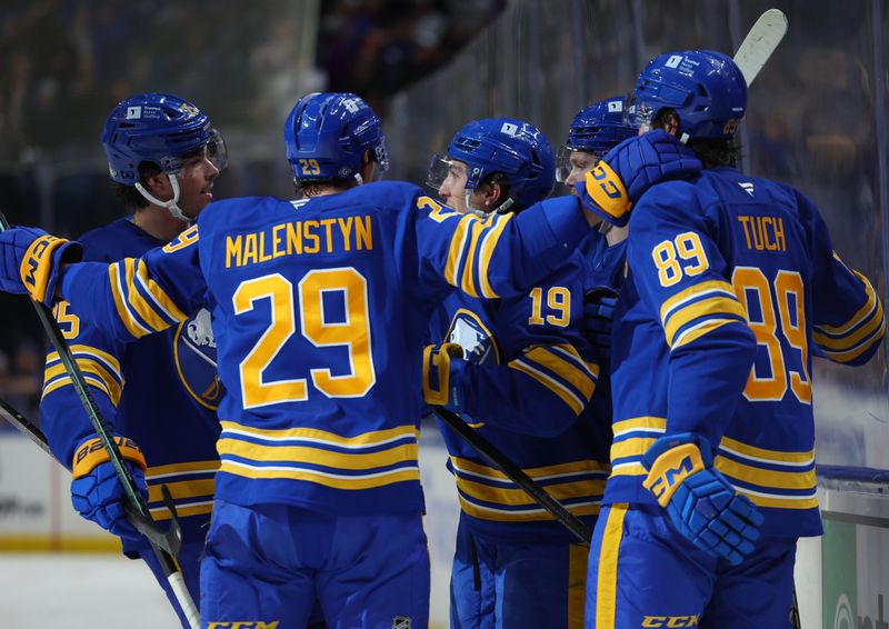 Oct 22, 2024; Buffalo, New York, USA;  Buffalo Sabres center Peyton Krebs (19) celebrates his goal with teammates during the second period against the Dallas Stars at KeyBank Center. Mandatory Credit: Timothy T. Ludwig-Imagn Images