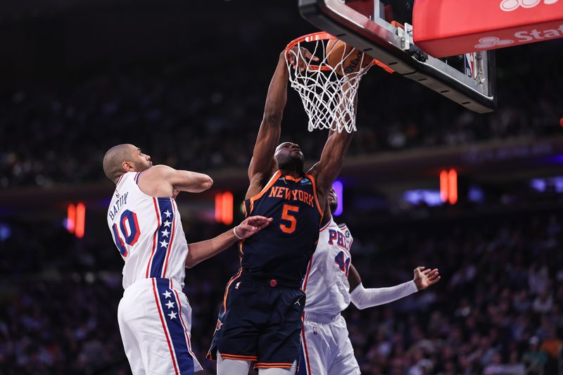 NEW YORK, NEW YORK - MARCH 12: Precious Achiuwa #5 of the New York Knicks dunks the ball during the third quarter against the Philadelphia 76ers at Madison Square Garden on March 12, 2024 in New York City. NOTE TO USER: User expressly acknowledges and agrees that, by downloading and or using this photograph, User is consenting to the terms and conditions of the Getty Images License Agreement. (Photo by Dustin Satloff/Getty Images)