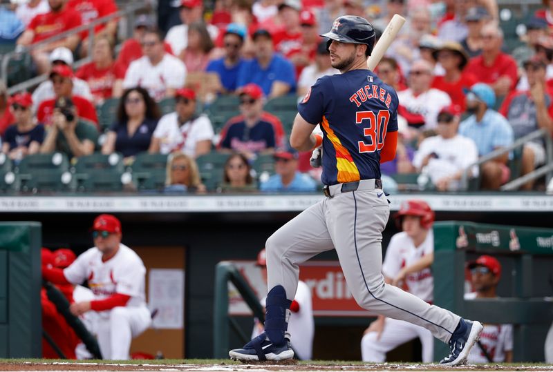 Mar 7, 2024; Jupiter, Florida, USA; Houston Astros right fielder Kyle Tucker (30) follows through on his RBI single against the St. Louis Cardinals in the first inning at Roger Dean Chevrolet Stadium. Mandatory Credit: Rhona Wise-USA TODAY Sports