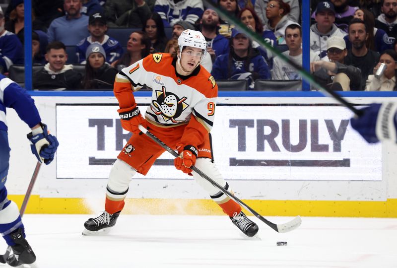 Jan 16, 2025; Tampa, Florida, USA; Anaheim Ducks center Leo Carlsson (91) skates with the puck as Tampa Bay Lightning center Anthony Cirelli (71) defends during the second period at Amalie Arena. Mandatory Credit: Kim Klement Neitzel-Imagn Images
