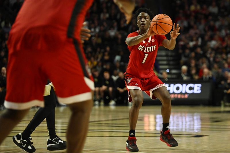 Jan 28, 2023; Winston-Salem, North Carolina, USA;  North Carolina State Wolfpack guard Jarkel Joiner (1) passes to North Carolina State Wolfpack forward D.J. Burns Jr. (30) during the second half at Lawrence Joel Veterans Memorial Coliseum. Mandatory Credit: William Howard-USA TODAY Sports