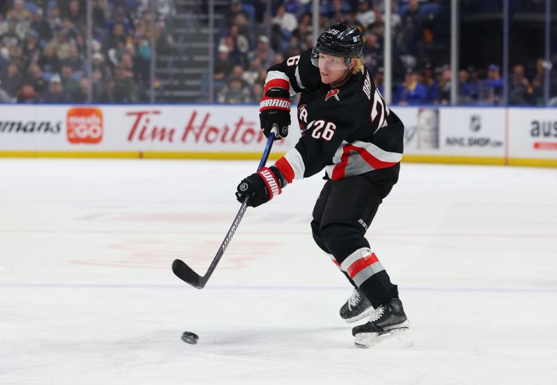 Mar 2, 2024; Buffalo, New York, USA;  Buffalo Sabres defenseman Rasmus Dahlin (26) takes a shot on goal during the second period against the Vegas Golden Knights at KeyBank Center. Mandatory Credit: Timothy T. Ludwig-USA TODAY Sports