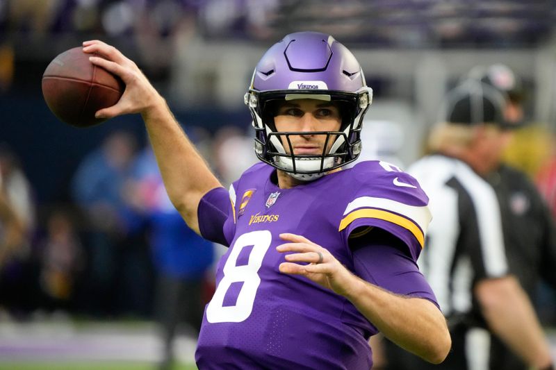 Minnesota Vikings quarterback Kirk Cousins warms up before an NFL wild card playoff football game against the New York Giants, Sunday, Jan. 15, 2023, in Minneapolis. (AP Photo/Charlie Neibergall)