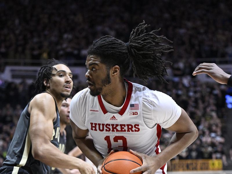 Jan 13, 2023; West Lafayette, Indiana, USA;  Nebraska Cornhuskers forward Derrick Walker (13) pushes toward the basket against Purdue Boilermakers forward Trey Kaufman-Renn (4) during the first half at Mackey Arena. Mandatory Credit: Marc Lebryk-USA TODAY Sports