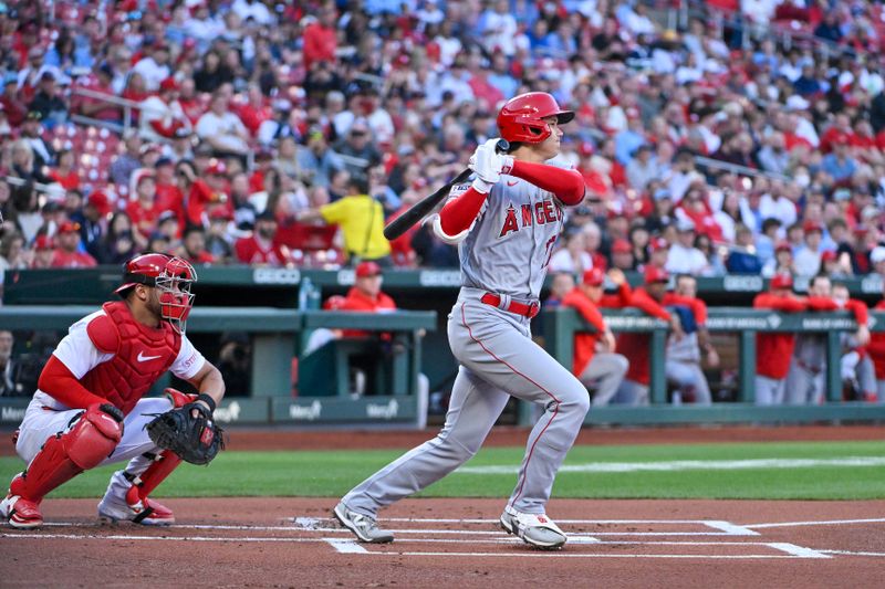 May 3, 2023; St. Louis, Missouri, USA;  Los Angeles Angels starting pitcher Shohei Ohtani (17) hits a single against the St. Louis Cardinals during the first inning at Busch Stadium. Mandatory Credit: Jeff Curry-USA TODAY Sports