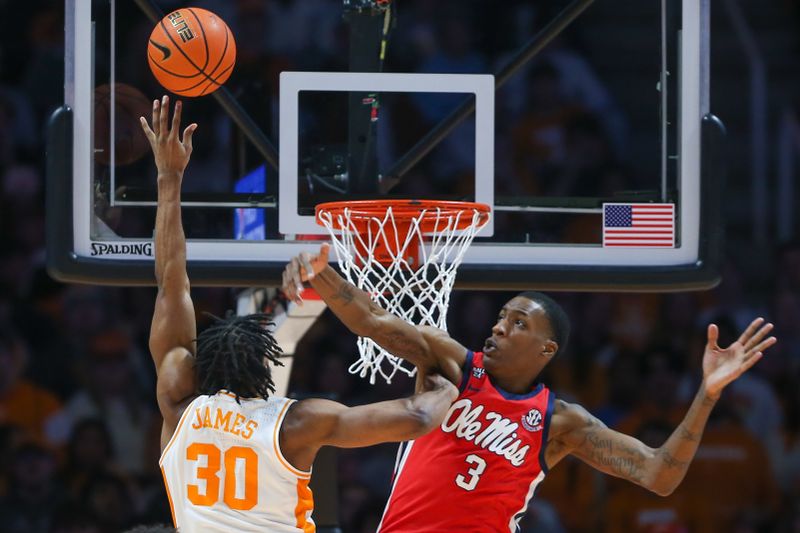 Jan 6, 2024; Knoxville, Tennessee, USA; Tennessee Volunteers guard Josiah-Jordan James (30) drives to the basket against Mississippi Rebels forward Jamarion Sharp (3) during the second half at Thompson-Boling Arena at Food City Center. Mandatory Credit: Randy Sartin-USA TODAY Sports