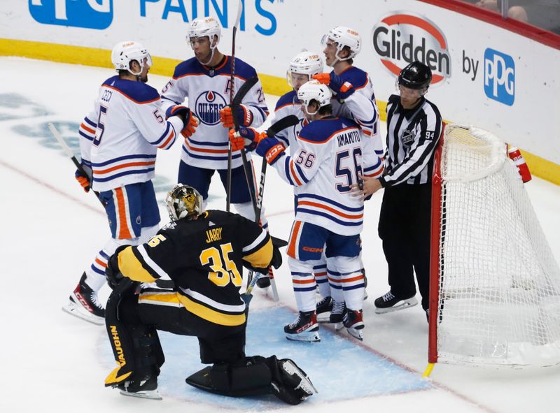 Feb 23, 2023; Pittsburgh, Pennsylvania, USA;  The Edmonton Oilers celebrate a goal by right wing Kailer Yamamoto (56) against the Pittsburgh Penguins goaltender Tristan Jarry (35) during the second period at PPG Paints Arena. Mandatory Credit: Charles LeClaire-USA TODAY Sports