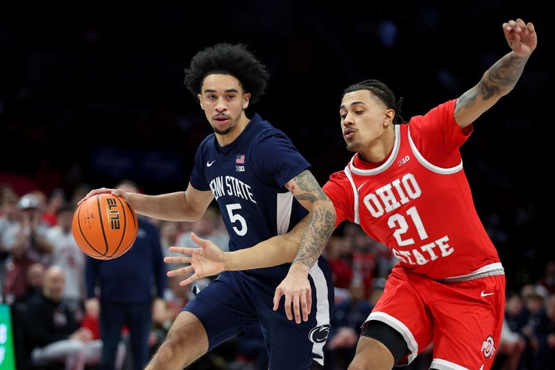 Jan 26, 2026; Columbus, Ohio, USA; Penn State Nittany Lions guard Freddie Dilione V (5) drives to the basket as Ohio State Buckeyes forward Devin Royal (21) defends during the first half at Value City Arena. Mandatory Credit: Joseph Maiorana-Imagn Images