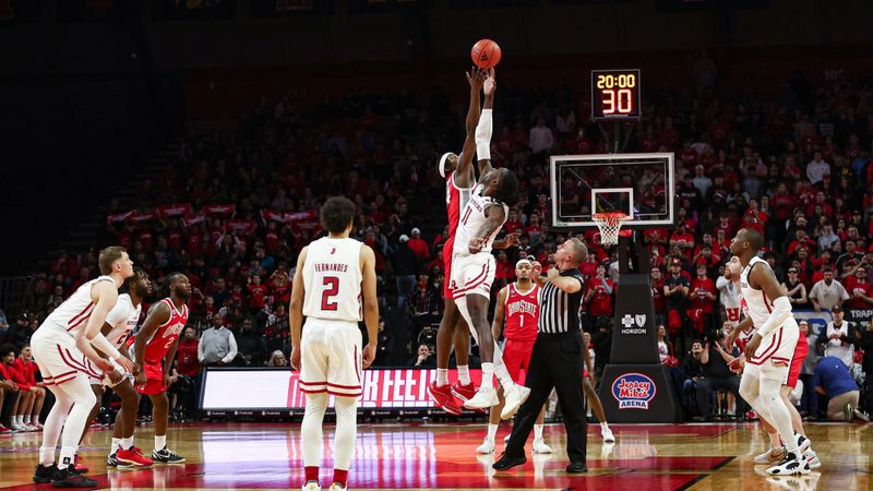 Mar 10, 2024; Piscataway, New Jersey, USA; Rutgers Scarlet Knights center Clifford Omoruyi (11) tips off against Ohio State Buckeyes forward Kalen Etzler (24) to start the game at Jersey Mike's Arena. Mandatory Credit: Vincent Carchietta-USA TODAY Sports