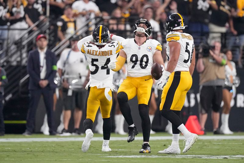 Pittsburgh Steelers linebacker T.J. Watt (90) celebrates on the field during the first half of an NFL football game against the Las Vegas Raiders Sunday, Sept. 24, 2023, in Las Vegas. (AP Photo/Mark J. Terrill)